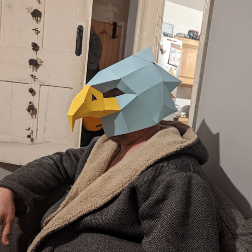 Man with 3D eagle mask