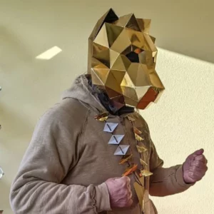 Low poly lion mask made of golden methacrylate